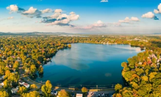 Parsippany, NJ Aerial view of a scenic lake surrounded by lush greenery and residential homes in Parsippany, NJ.